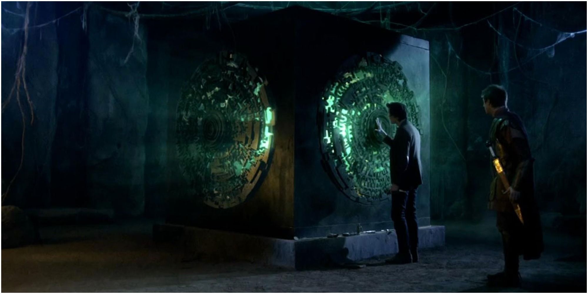 The Eleventh Doctor and Rory Pond stand by the Pandorica which glows green in Doctor Who.