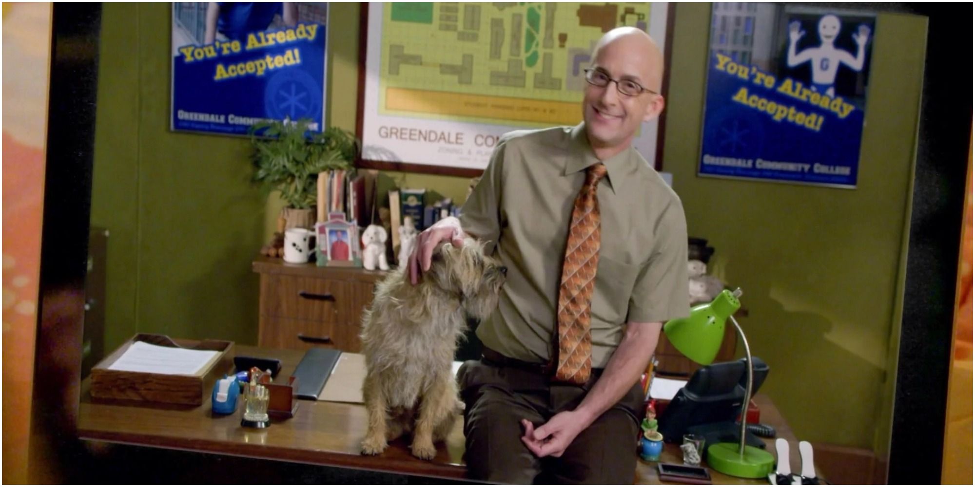 Dean Pelton poses with the dog that almost got a degree at Greendale