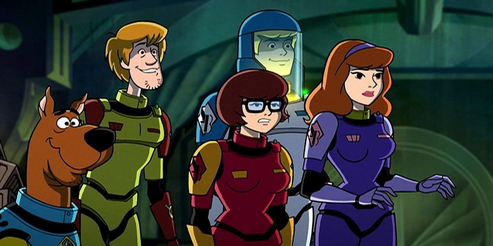 Scooby, Shaggy, Velma, Fred, and Daphne wearing space suits.