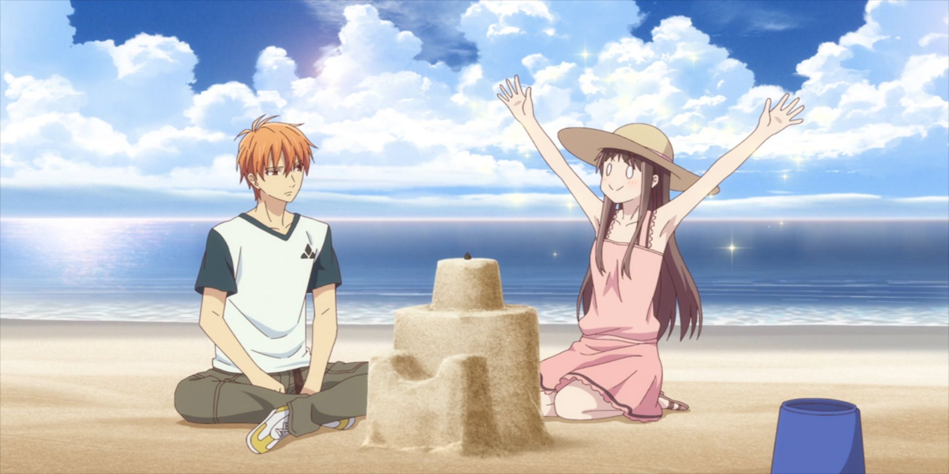 Tohru and Kyo build a sandcastle in Fruits Basket at the beach.