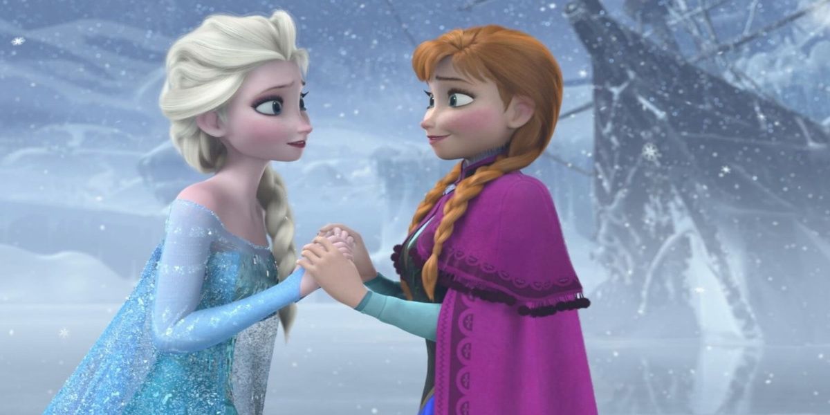 Anna and Elsa hold hands at the end of Frozen