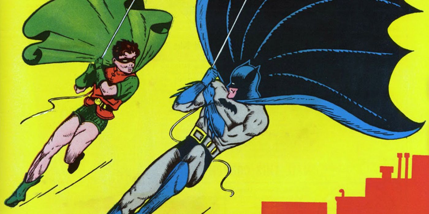Batman and Robin swing over Gotham City