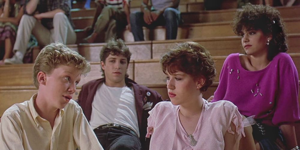 the gang have a conversation on the steps in Sixteen Candles