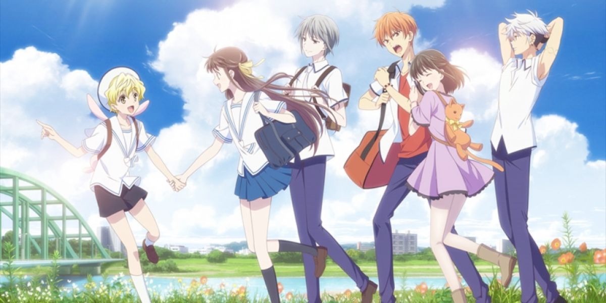 Fruits Basket: Momiji holds Tohru's hand, Yuki smiles, Kagura hugs Kyo, and Hatsu reaches up.