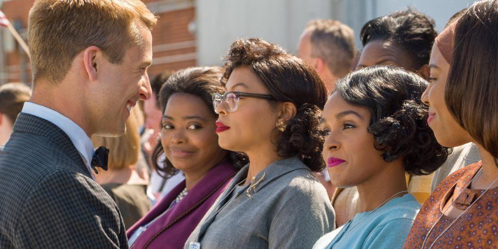 Glen Powell, Octavia Spencer, Taraji P. Henson and Janelle Monae stand together in Hidden Figures.