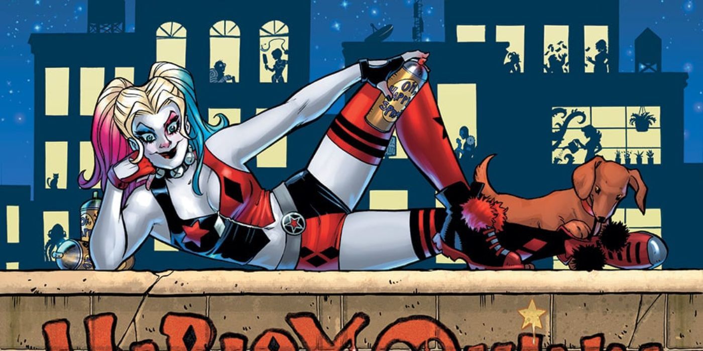 Harley Quinn lounges on a cement wall in DC Comics