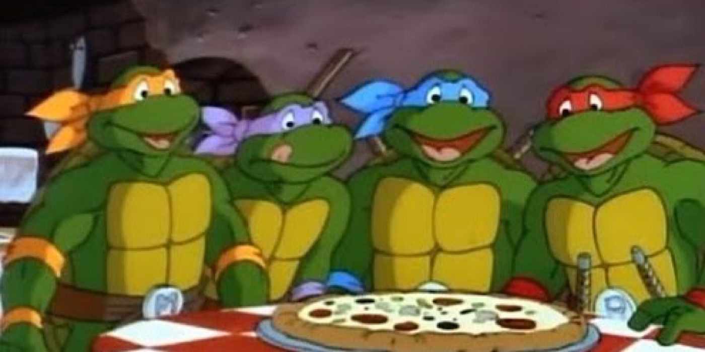 Leonardo, Donatello, Michelangelo, and Raphael sitting around a pizza - Teenage Mutant Ninja Turtles