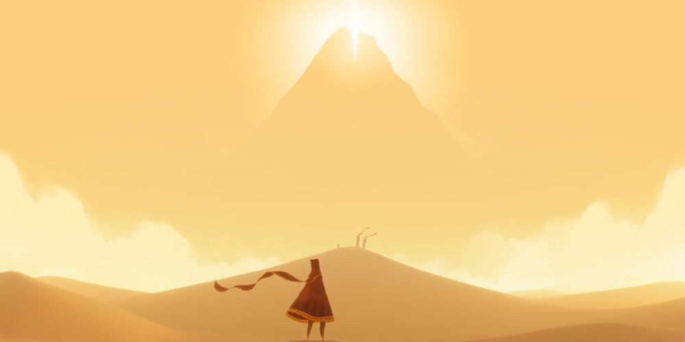 Una figura vestida mirando una montaña lejana en el juego Journey