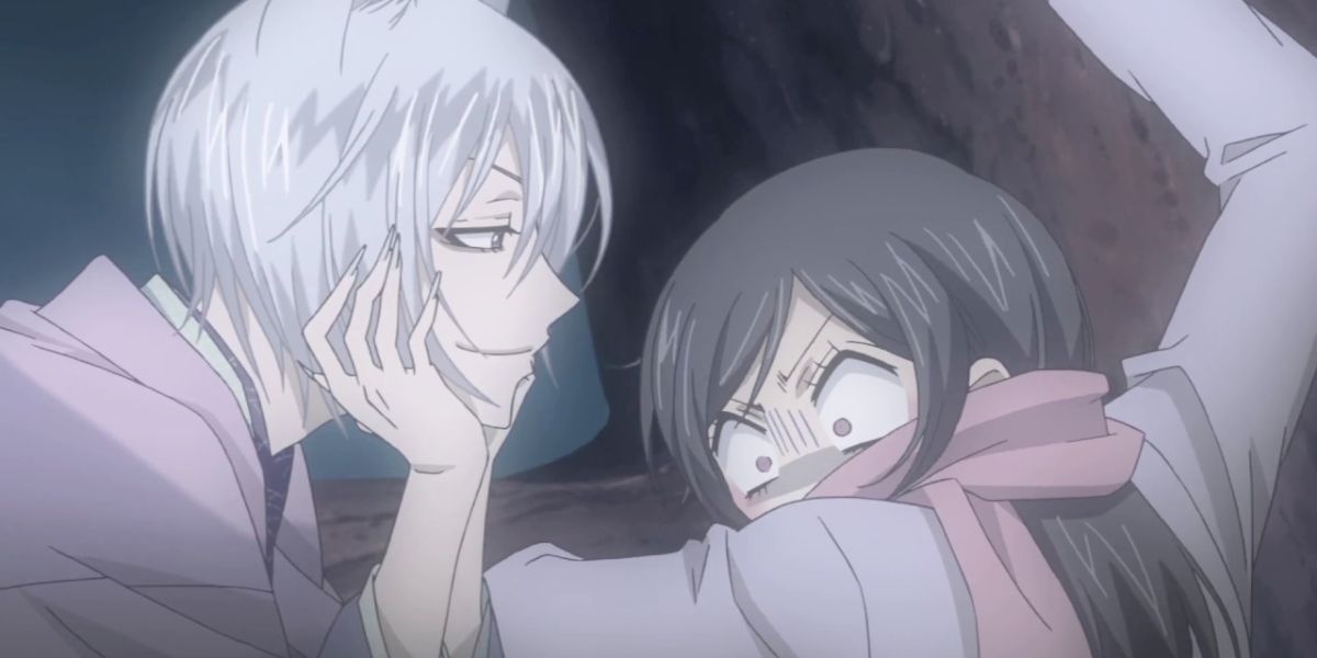 Image features a visual from Kamisama Kiss: (From left to right) Tomoe (silver hair and light purple kimono) is teasing Nanami Momozono (long, brown hair, pink scarf and purple jacket).