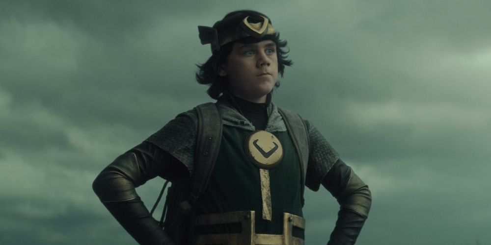 Kid Loki thinks, while resting his hands on his hips.