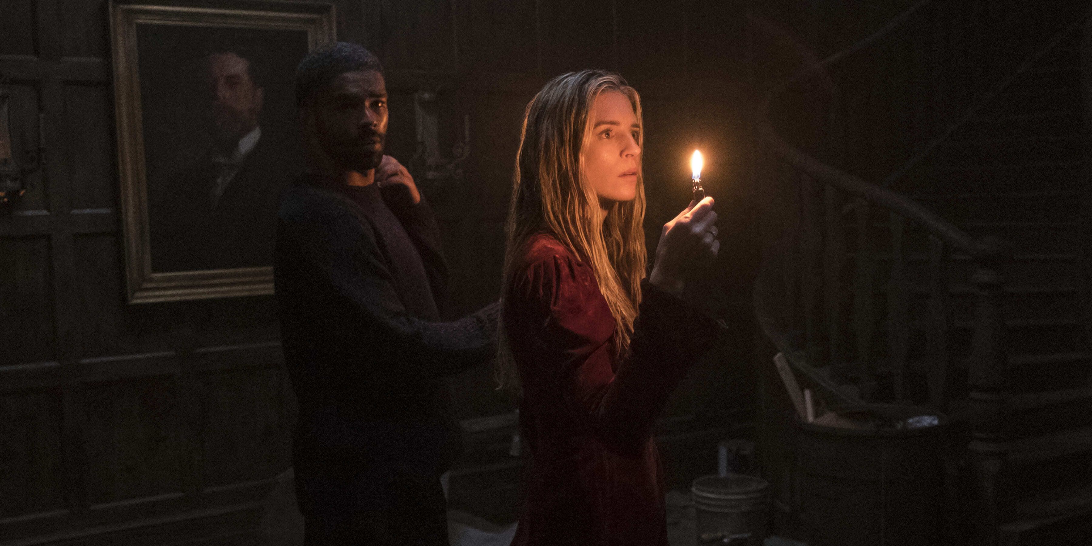 Prairie and Karim holding up a candle in The OA