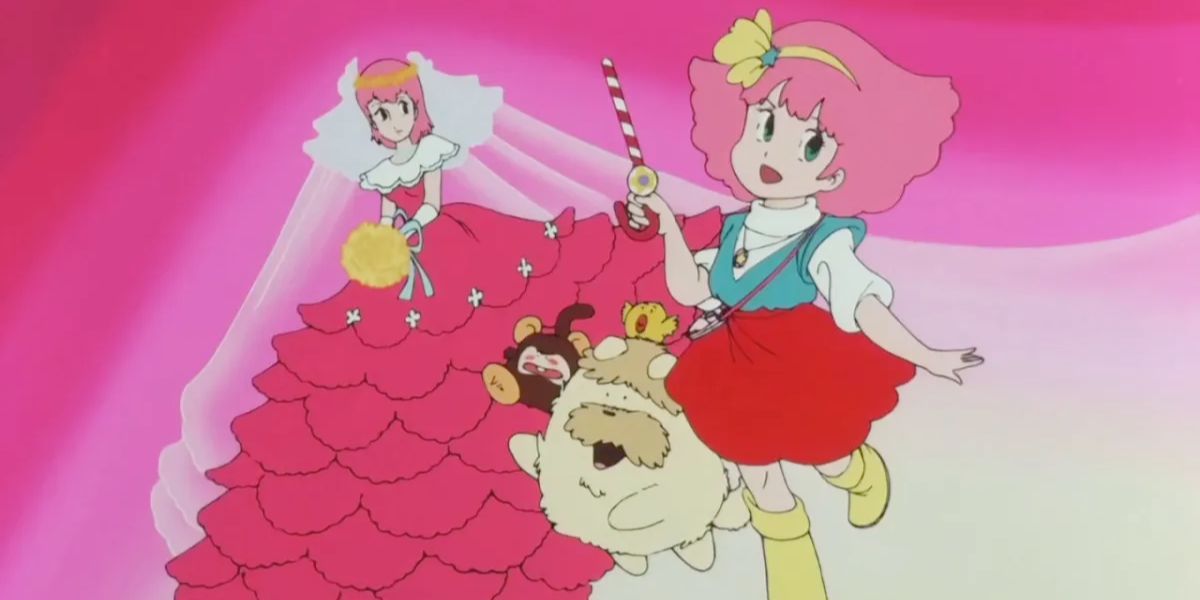The picture shows a portrait from Magical Princess Minky Momo: (left to right) Momo (adult version) in a red dress and holding a yellow bouquet, Moka (brown monkey), Sindbook (cream-colored dog), Pepero (yellow bird), and Momo holding her cane .