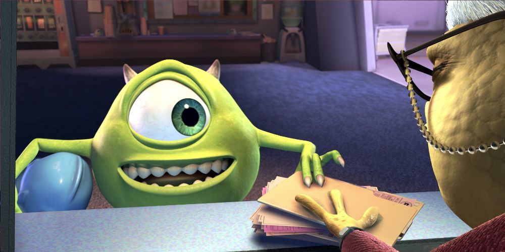 Mike Wazowski getting his paperwork from Roz in Monster’s Inc.