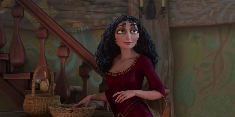 Mother Gothel from Disney's Tangled stands by the stairs.