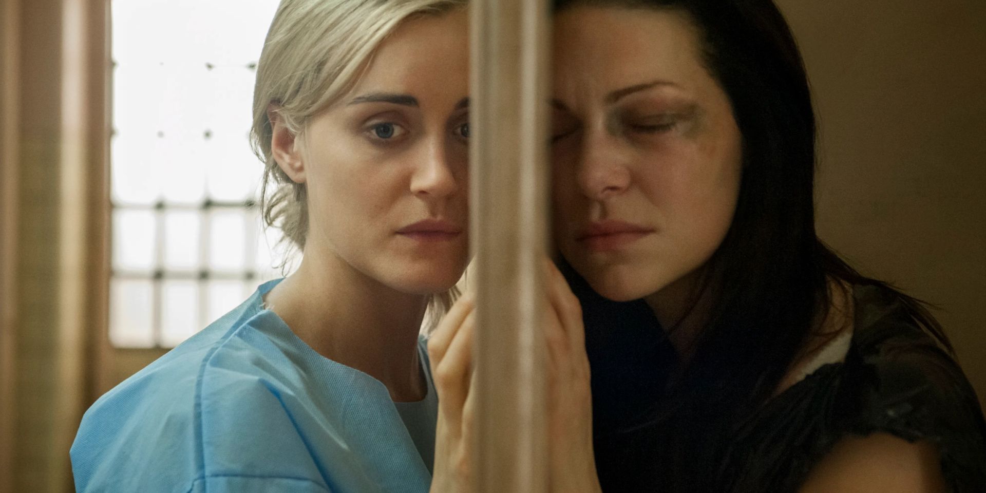 Piper and Alex stand on the other side of the door in Orange is the New Black.