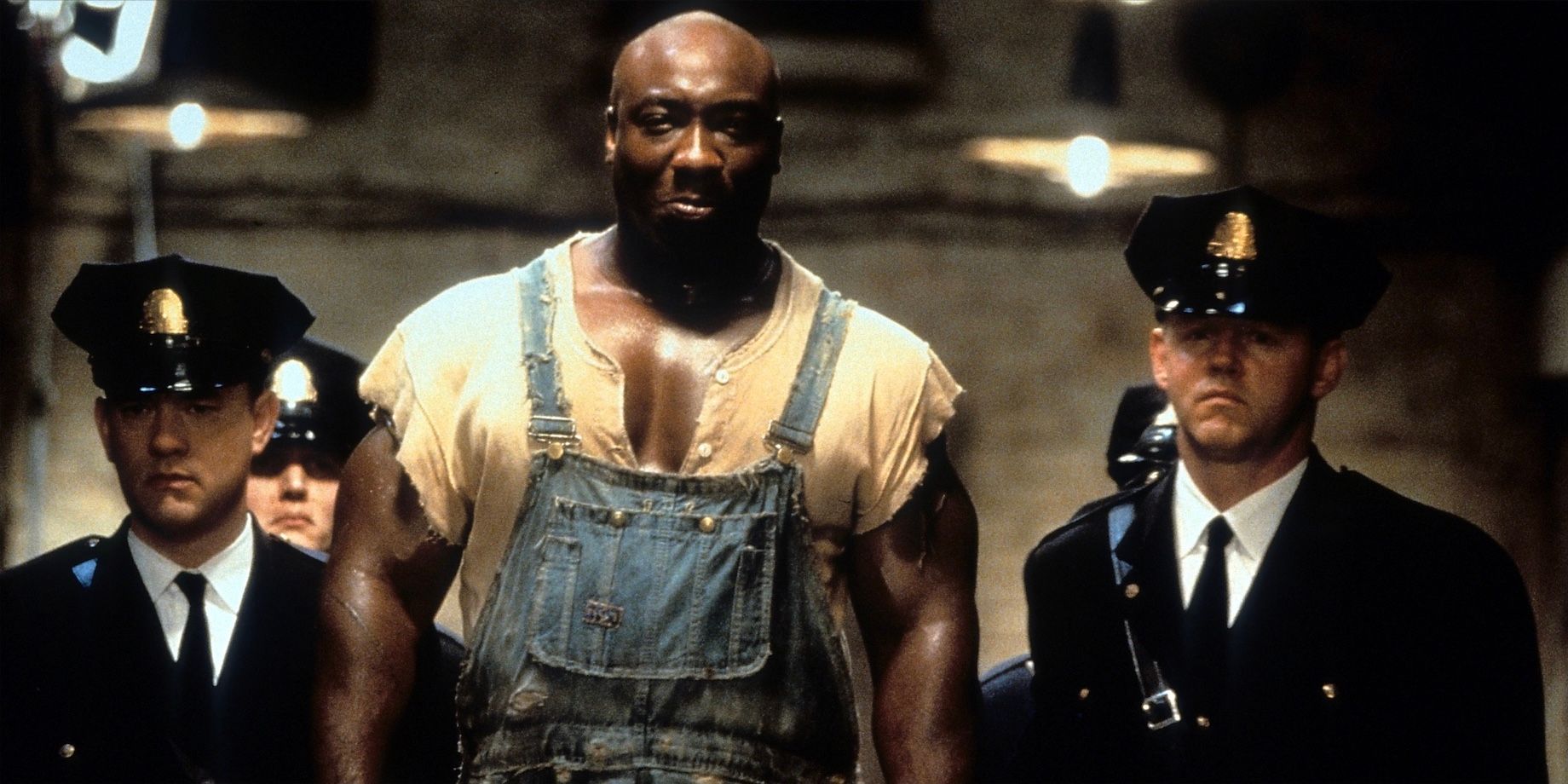 Tom Hanks walking with Michael Clarke Duncan in The Green Mile (1999).