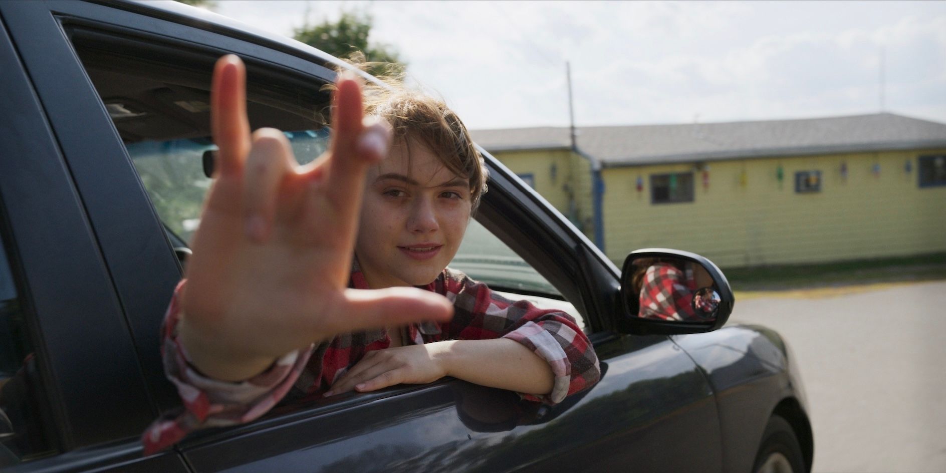 Emilia Jones as Ruby Rossi in a car in the film CODA