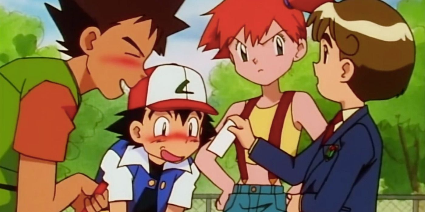 Ash, Brock, and Misty looking at a picture in Pokémon.