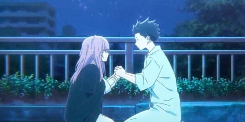 Shouko Nishimiya and Shoya Ishida kneeling at a bridge from A Silent Voice