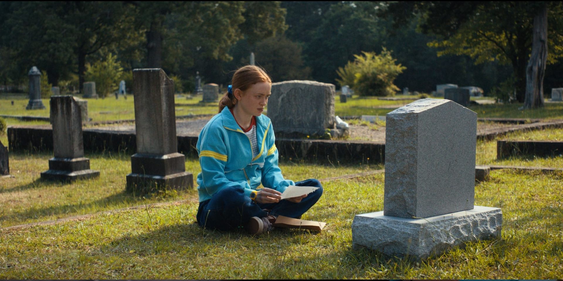 Max reads her letter to Billy at the cemetery in Stranger Things