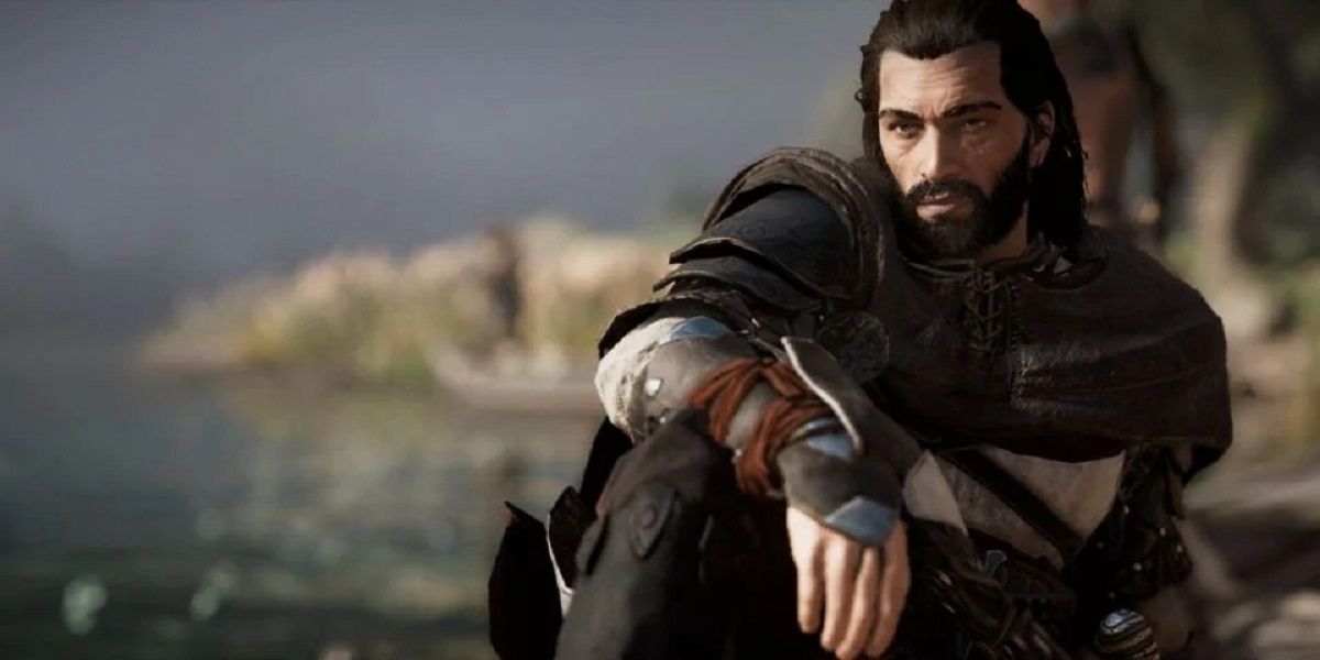 Basim sits on a rooftop in front of the ocean in Assassin's Creed: Valhalla