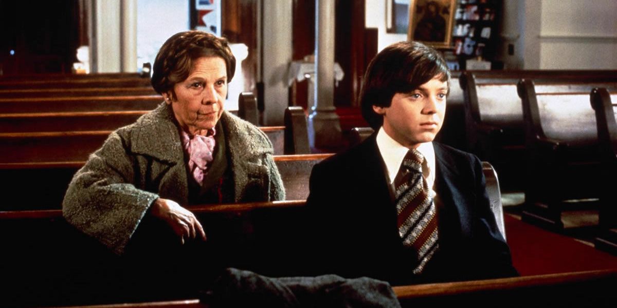 Harold and Maude sitting in a pew.
