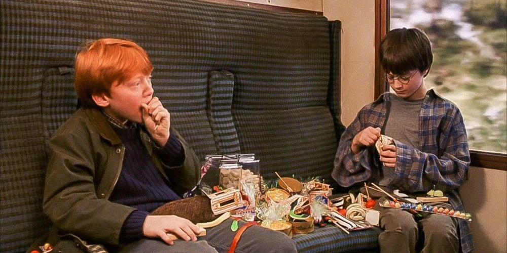 harry and ron eating candy from the trolley on the hogwarts express