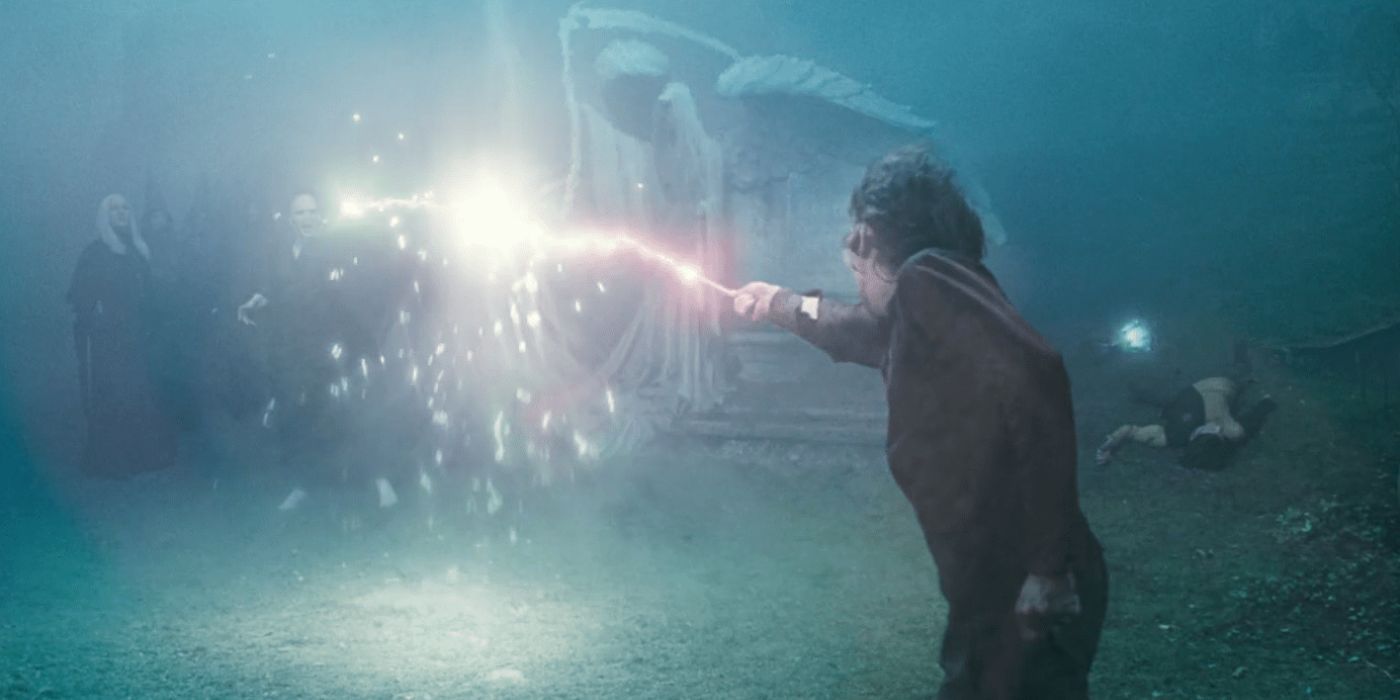 Harry Potter and Voldemort fighting in the graveyard