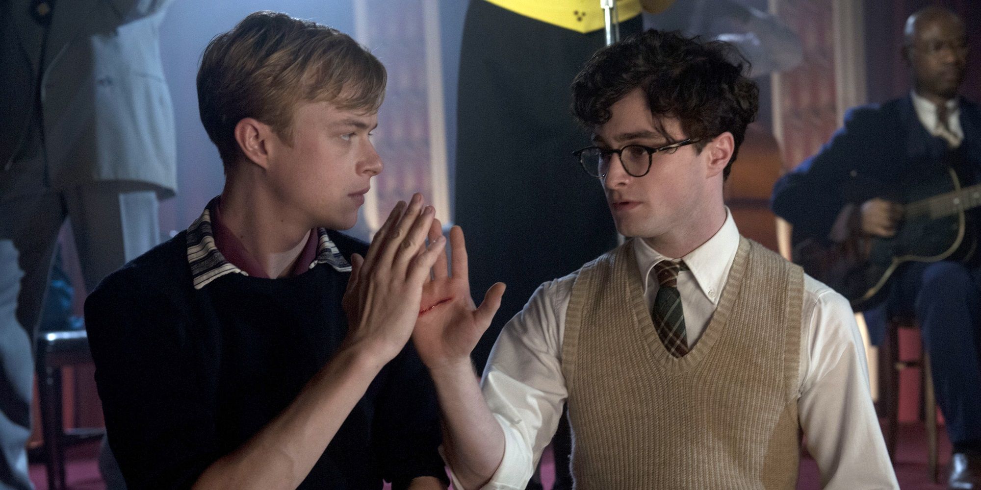 Allen and Lucien touching hands in Kill Your Darlings
