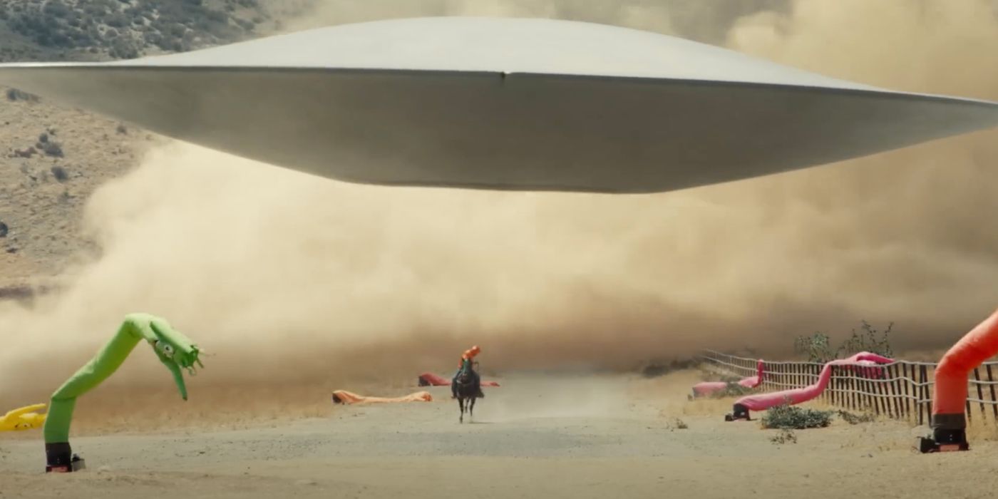 A low altitude UFO flies by kicking up an enormous dust cloud
