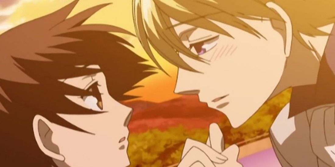 Tamaki holding Haruhi's hand and gazing into her eyes in Ouran High School Host Club