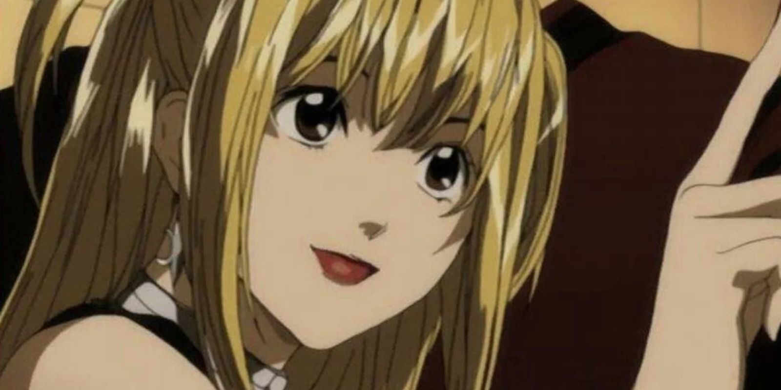 Misa Amane staring at something off-screen with a grin on her face in Death Note