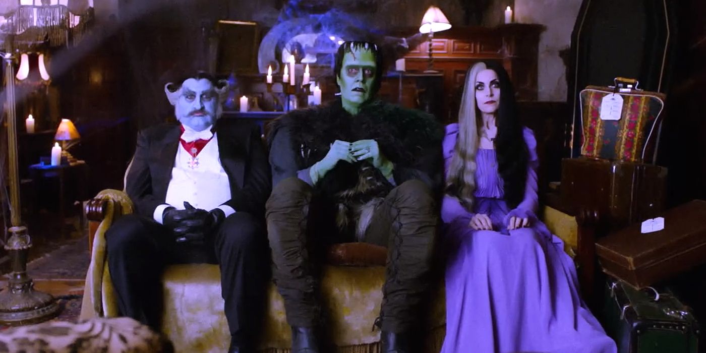 Grandpa, Herman, and Lily Munster sitting down in Rob Zombie's The Munsters.