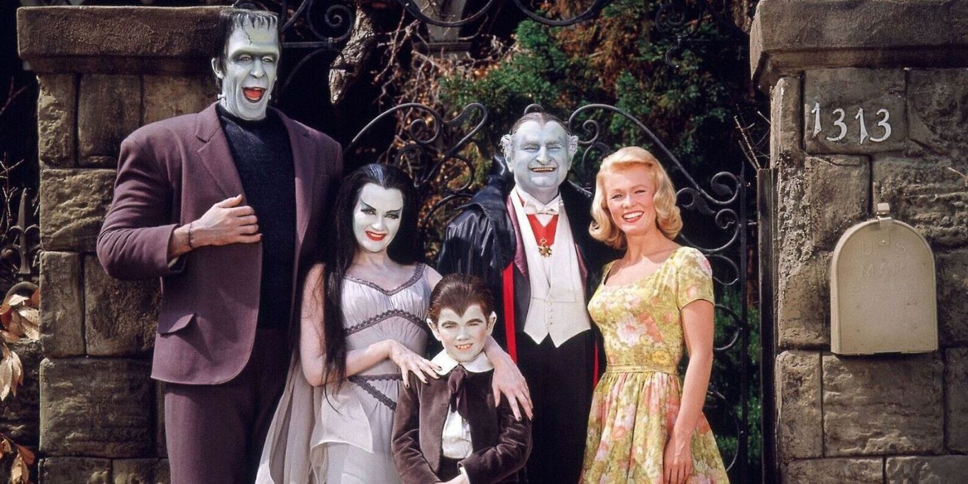 The Munsters Family (in color) standing in front of 1313 Mockingbird Lane.