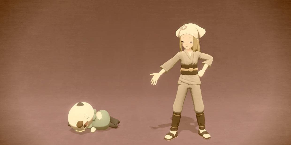 An oshawatt playing dead next to a disappointed trainer in Arceus Legends' photo mode