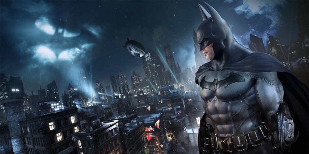 Batman looming in front of the city in Batman: Arkham City game