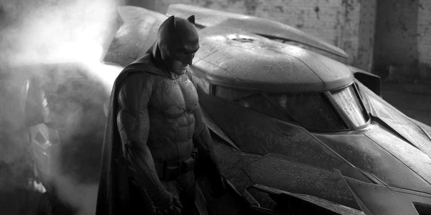 Batman by his Batmobile in DC Comics