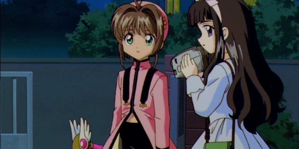 Cardcaptor Sakura stares confused alongside Tomoyo in Cardcaptor Sakura.