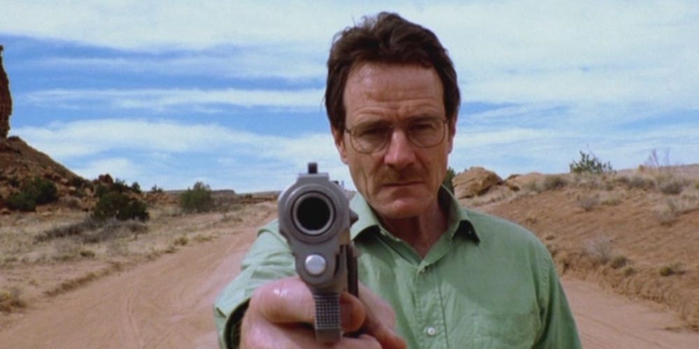 Walter White pointing his gun toward the police in the pilot of Breaking Bad.