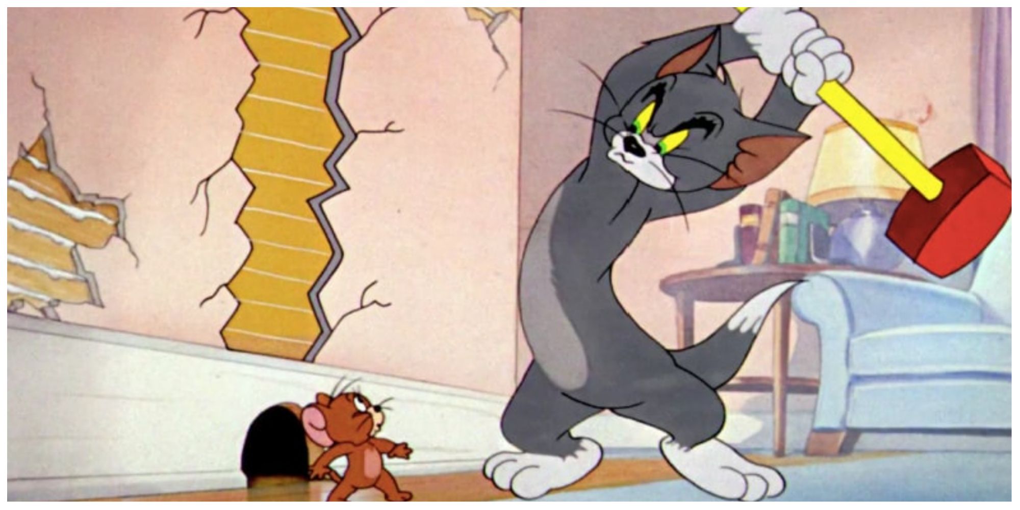 Tom trying to smash Jerry with a hammer