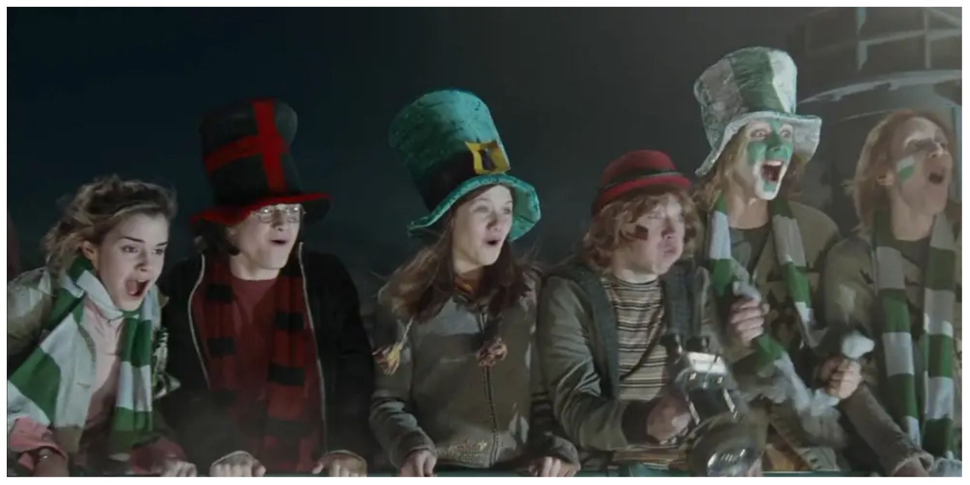 Harry Potter and friends cheering during the Quidditch World Cup