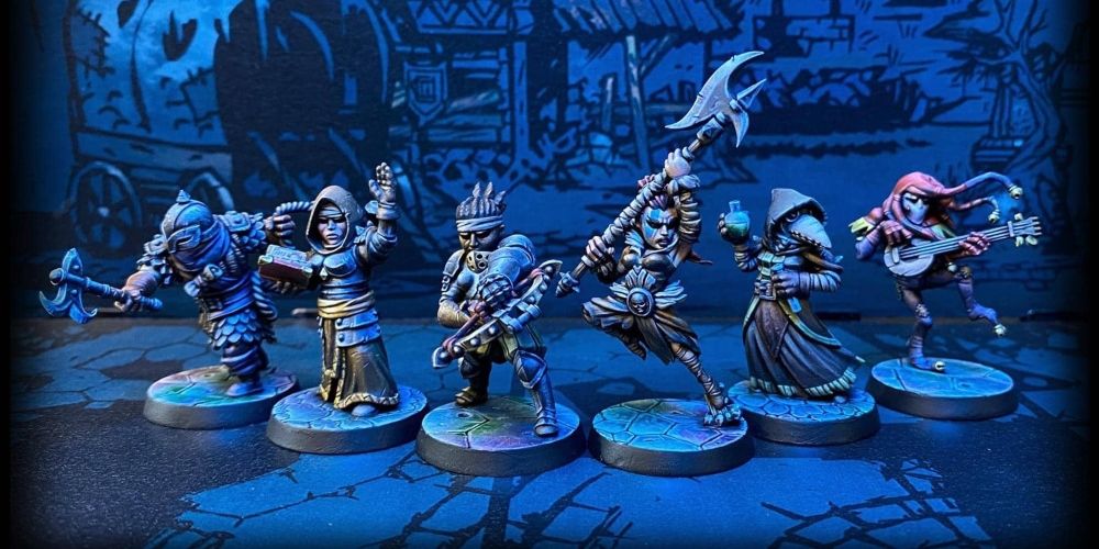 A collection of player miniatures from the Darkest Dungeon board game