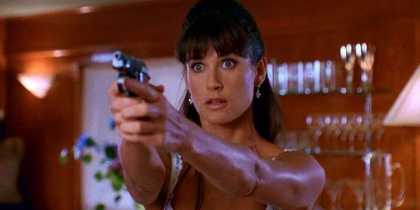 Demi Moore with a gun in hand from the film Striptease.