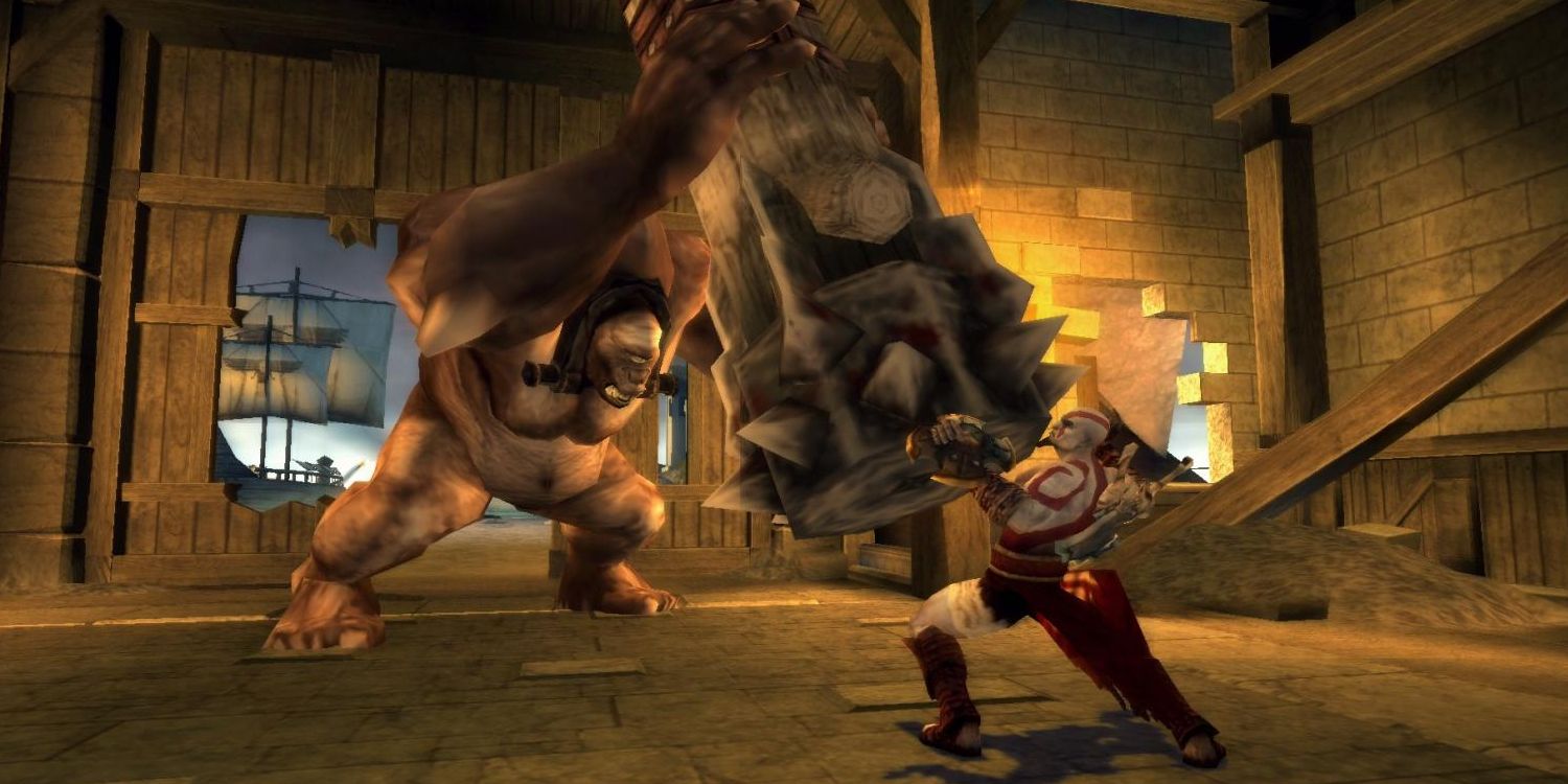 Kratos defending himself from a Cyclops in God of War Chains of Olympus