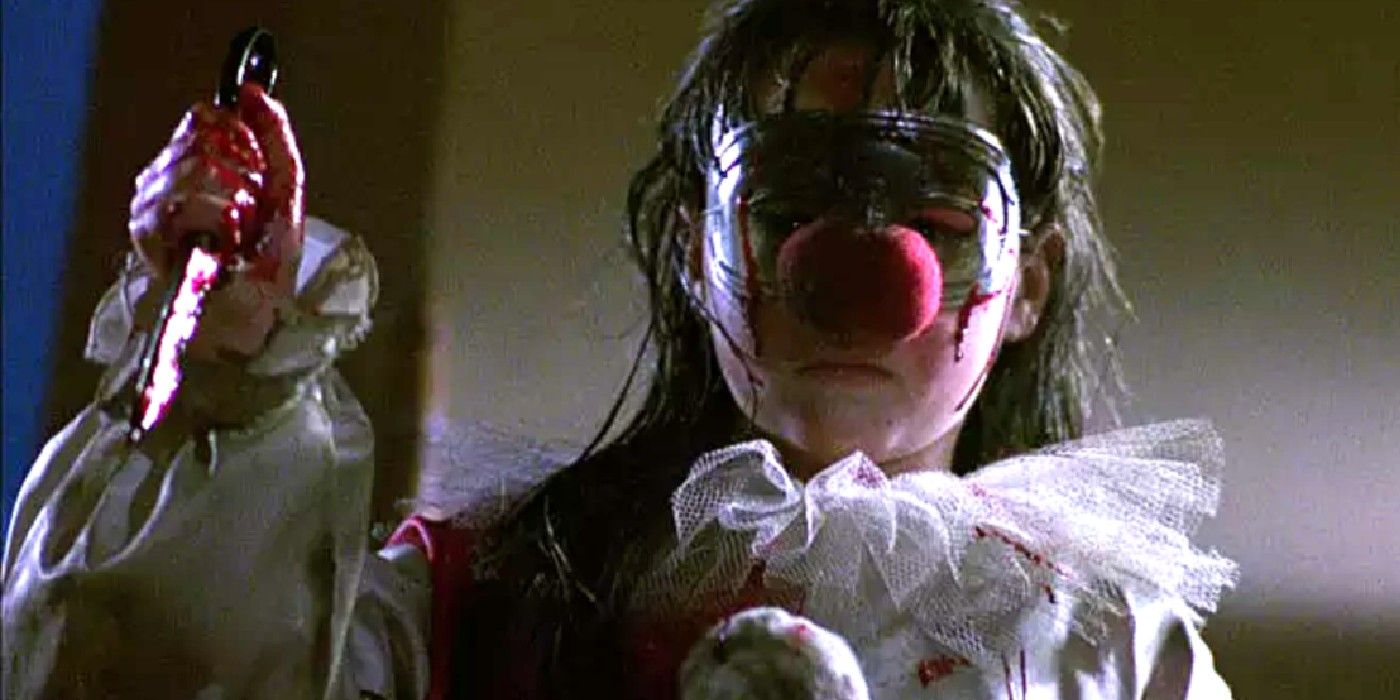 Jamie holds a knife in a clown costume at the end of Halloween 4: The Return of Michael Myers