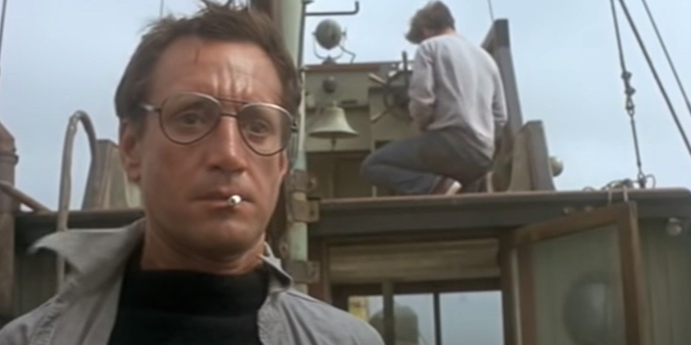 Martin Brody smoking a cigarette on a boat in the film, Jaws