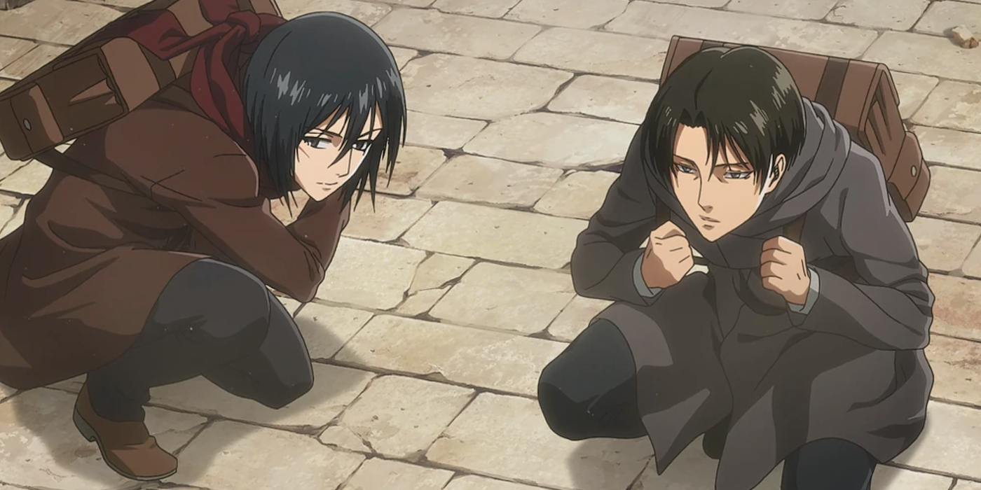 Levi and Mikasa crouching in Attack On Titan.