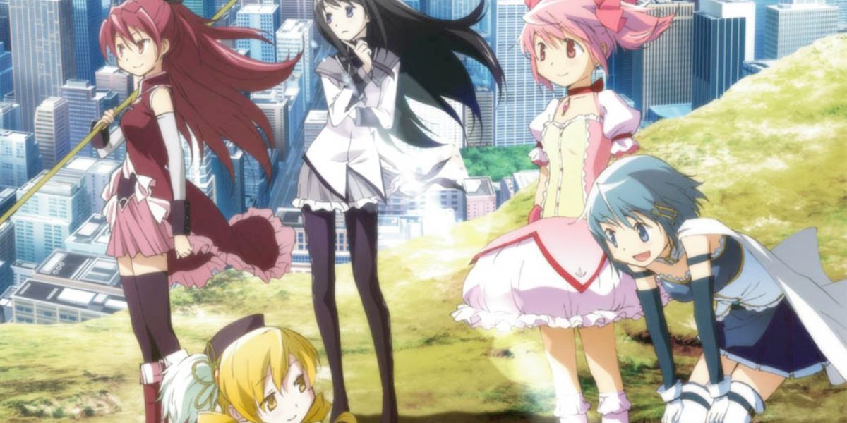 Image features a visual from Puella Magi Madoka Magica: (From left to right) Kyoko Sakura (red hair and dress) is holding her spear, Mami Tomoe (blonde hair and brown mini hat) is looking upward, Homura Akemi (long, black hair and gray uniform) is holding her arms in front of her, Madoka Kaname (pink hair and dress) is looking forward, and Sayaka Miki (blue hair and uniform) is talking with Mami.