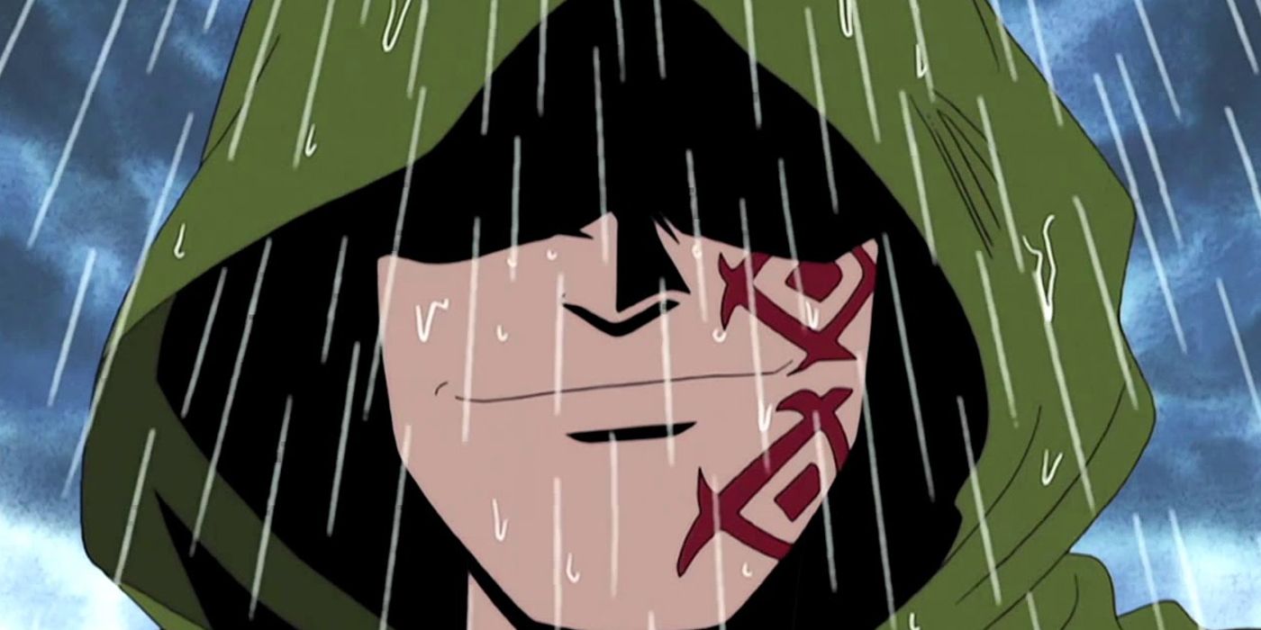 Monkey D Dragon smirking in the rain with his eyes covered by a hood