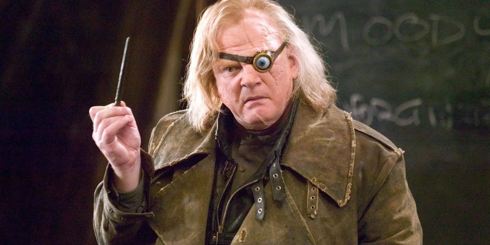 Mad-Eye Moody holding his wand in Harry Potter.